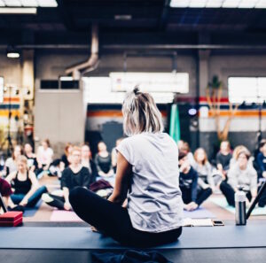 Yoga instructor teaching a yoga class